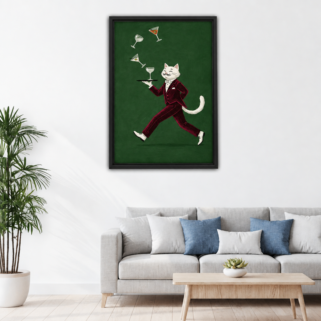 Framed cocktail waiter cat canvas wall art hanging above a light sofa in a living room.
