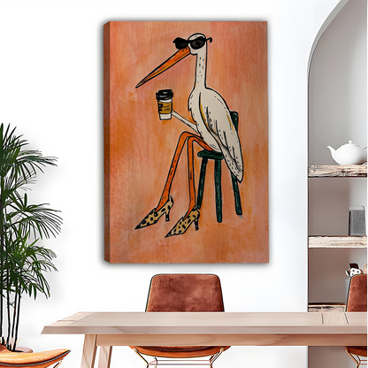 Black-framed coffee bird canvas wall art with a peach-orange background displayed above a dining table.