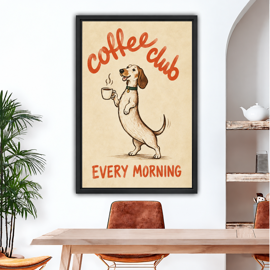 Framed Coffee Club dog canvas wall art with visible wrapped edges hanging above a wooden dining table.