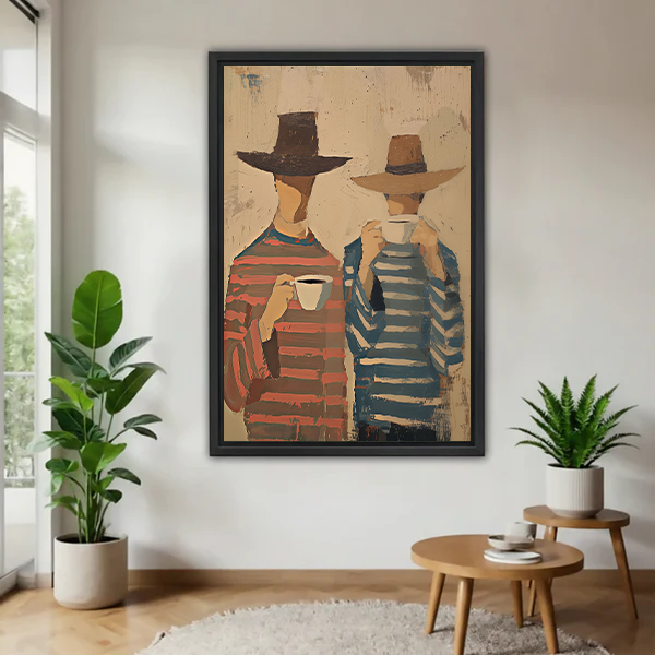 Framed coffee companions canvas wall art featuring hat-wearing figures in striped tops, displayed between indoor plants.