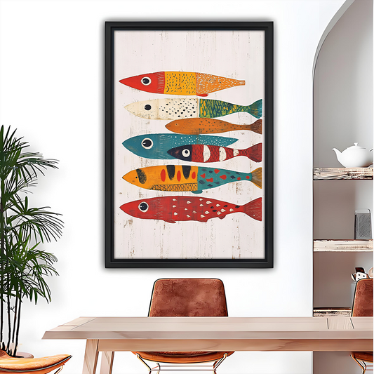 Woman holding black framed colorful folk art fish canvas wall art featuring seven patterned fish on an off-white background.