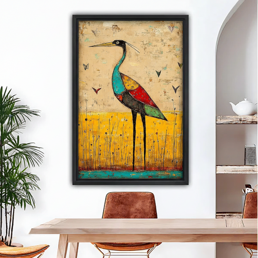 Vibrant abstract heron framed wall art print hung in dining room with rustic wooden table and chairs