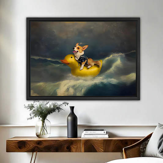 Funny corgi riding yellow rubber duck in stormy ocean framed canvas wall art in black float frame above wooden console