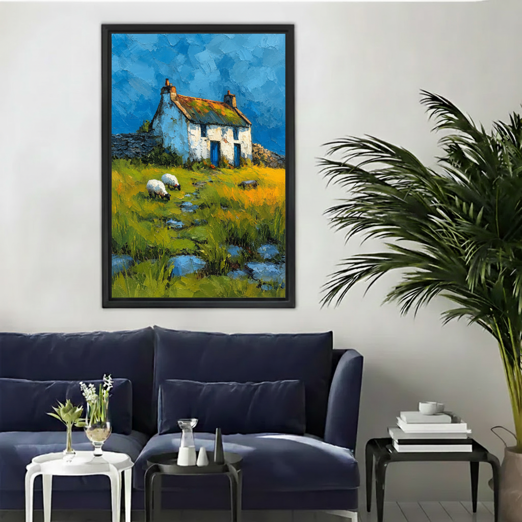  Framed country cottage and sheep canvas wall art displayed above a modern dark blue sofa.