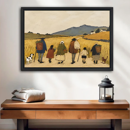 Black-framed countryside walk canvas wall art with golden fields above a wooden console beside a black lantern.