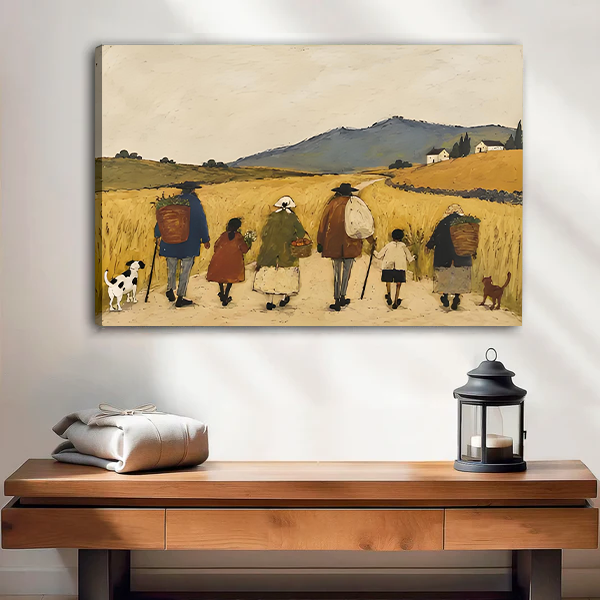 Woman holding framed countryside walk canvas wall art featuring rural walkers, dogs, golden fields, and distant hills.