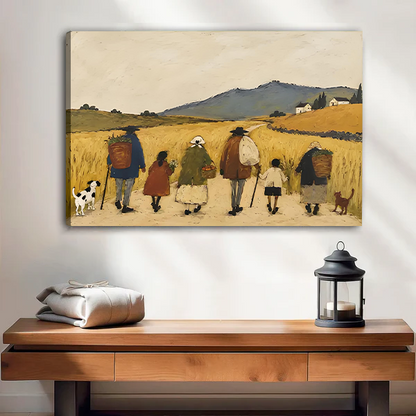 Woman holding framed countryside walk canvas wall art featuring rural walkers, dogs, golden fields, and distant hills.