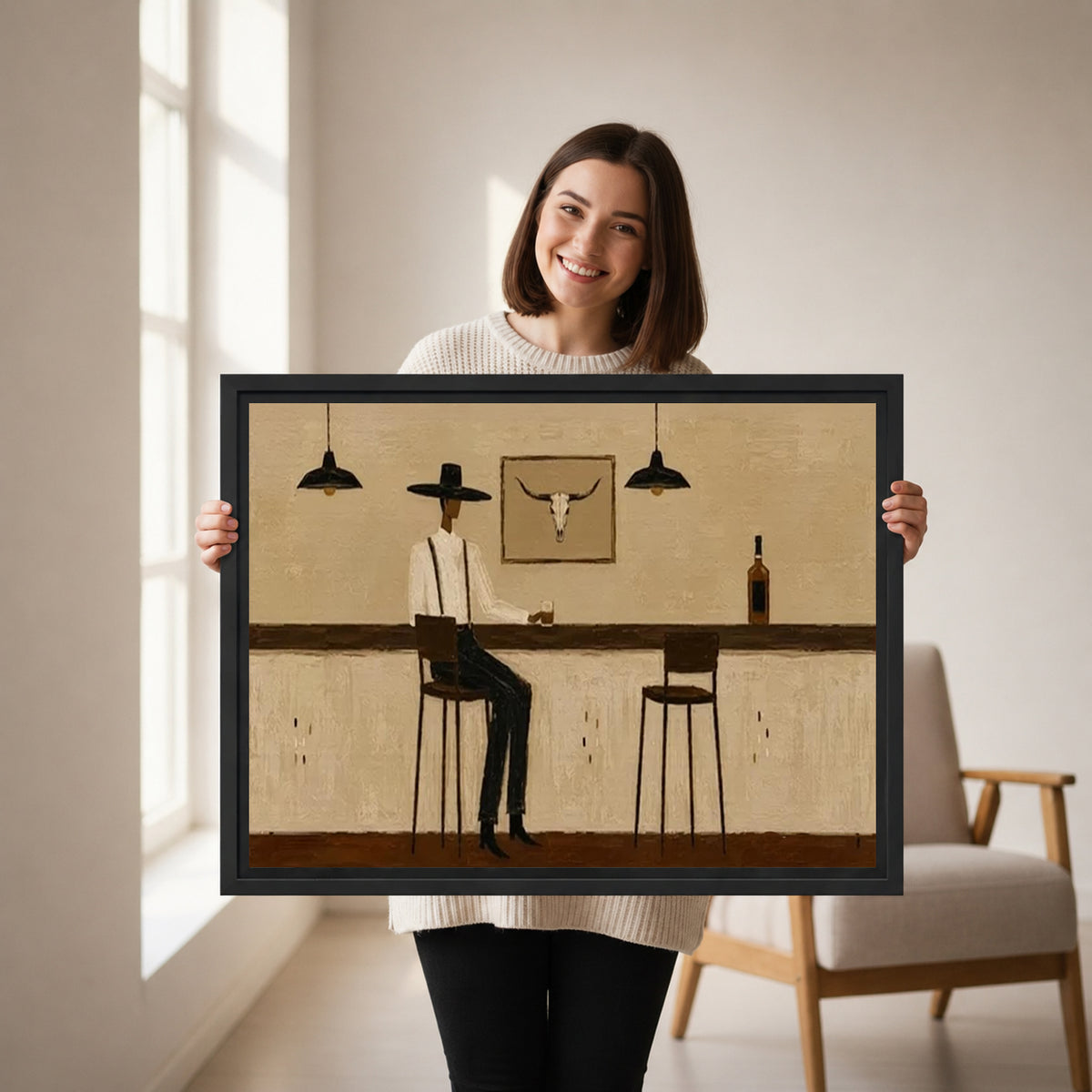 Woman holding framed Western cowboy bar canvas wall art featuring a seated cowboy and an empty stool