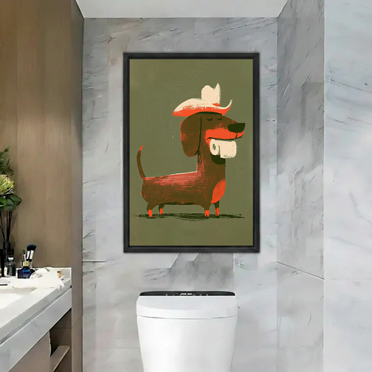 Two women beside framed cowboy dachshund canvas wall art featuring a toilet paper roll in a pink bathroom.