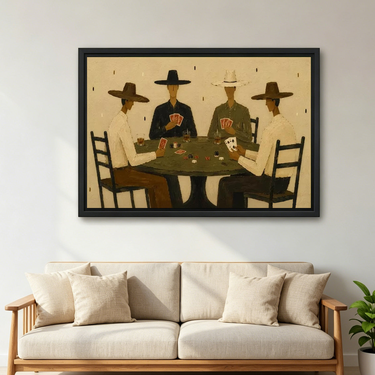 Large framed cowboy poker canvas wall art in warm earth tones above a cream living room sofa