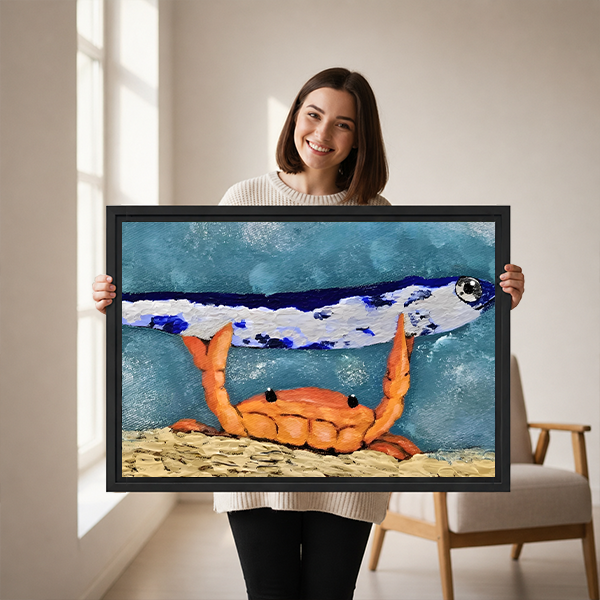 Woman holding framed whimsical crab and fish canvas wall art with orange claws and a sandy seabed.
