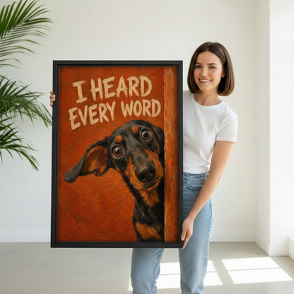 Woman holding large framed dachshund "I Heard Every Word" wall art print showing size scale