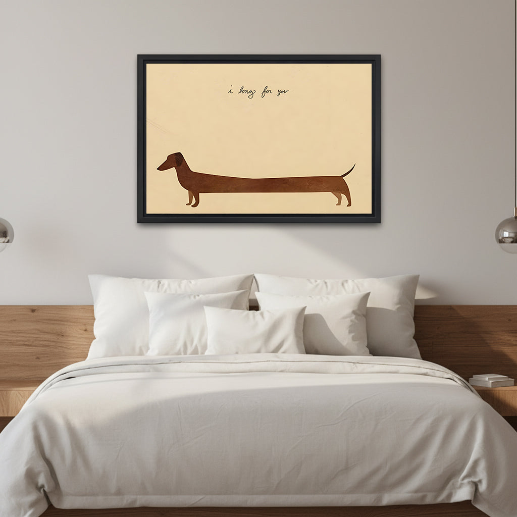 Dachshund I long for you minimalist cream background long chocolate brown silhouette handwritten script black framed canvas wall art on white wall above wood slab headboard bed with white linen and silver wall sconces