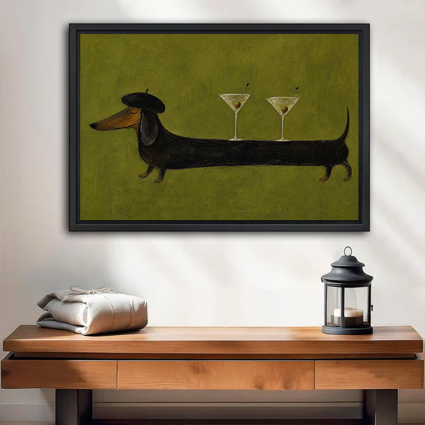 Framed dachshund martini canvas wall art above a wooden bench with a black candle lantern