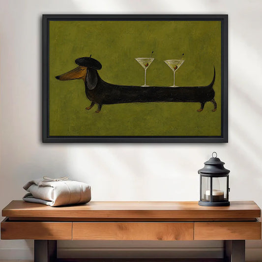 Framed dachshund martini canvas wall art above a wooden bench with a black candle lantern