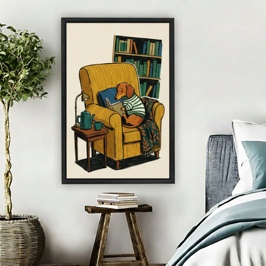 Vintage dachshund reading book in yellow armchair framed canvas wall art hung in cozy bedroom beside potted plant and nightstand