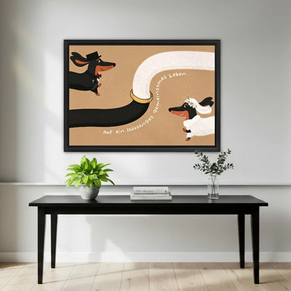 Whimsical dachshund bride and groom wedding framed canvas wall art hung above black console table in bright entryway