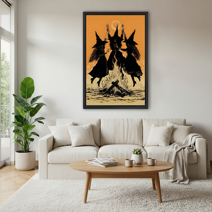 Framed dancing witches canvas wall art featuring three pointed hats and a crescent moon, displayed between green houseplants.