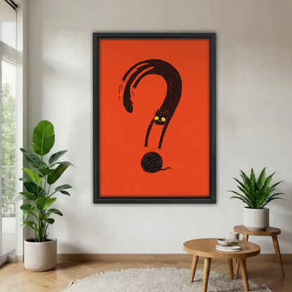 Funny black cat question mark graphic framed canvas wall art – black frame, bold orange-red background, yellow glowing eyes, hung on white wall in minimalist living room with tropical plants and round wood table