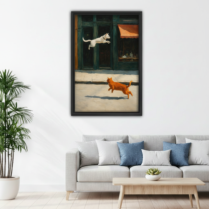 Black framed dog chasing cat canvas print hanging in living room above gray sofa