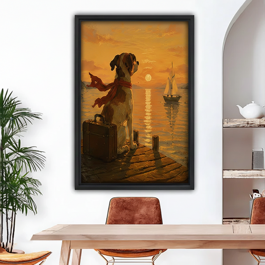 Black framed canvas print of a dog with red scarf and suitcase on a wooden dock watching a sailboat at golden sunset, dining room wall art