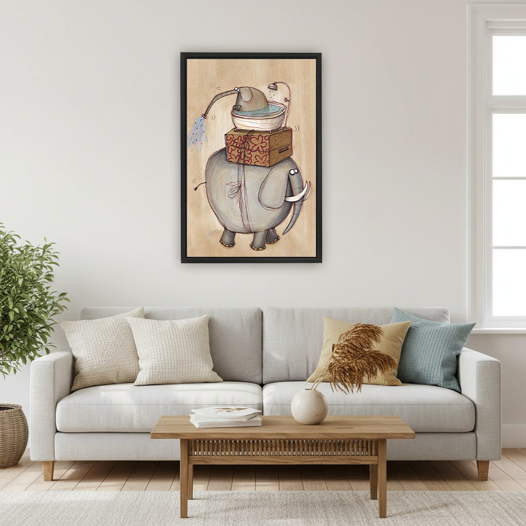 Woman seated on a sofa holding black-framed elephant bath canvas wall art featuring a whimsical two-elephant bathing scene.