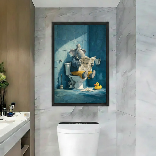 Whimsical elephant reading newspaper framed canvas wall art hanging above toilet in marble bathroom