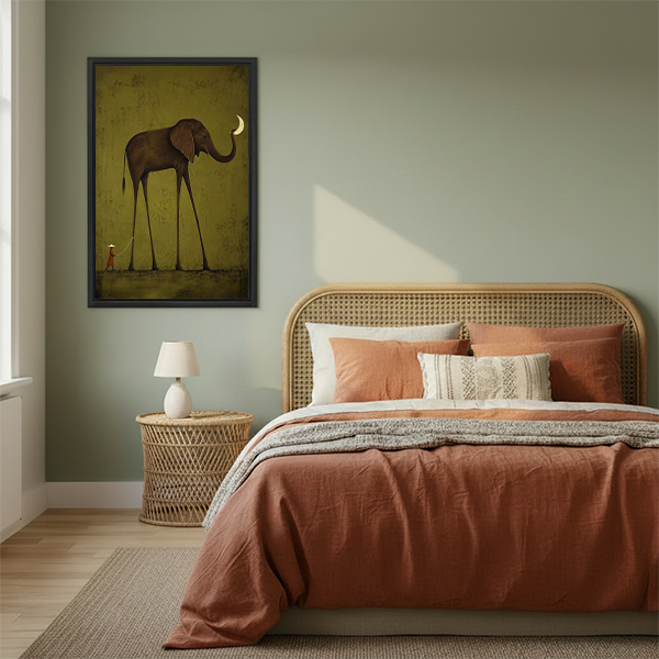 Black-framed elephant moon canvas wall art featuring a crescent moon and olive tones above a light sofa.