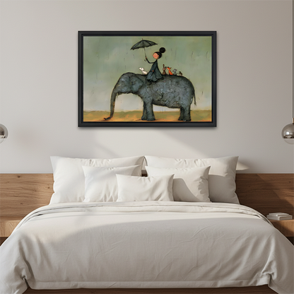 Black-framed whimsical elephant umbrella canvas wall art above a wooden console table, featuring a rider sheltering beneath an umbrella.