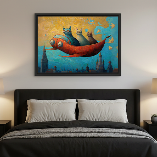 Fantasy flying cats on red fish framed art print with golden blue sky and castle silhouettes, displayed as bedroom wall decor above a dark upholstered bed