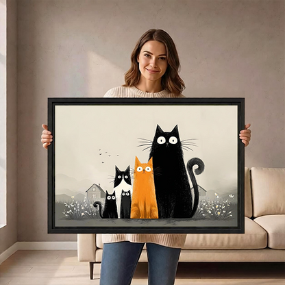 Woman holds framed five cats canvas wall art showing four black cats and one orange cat.