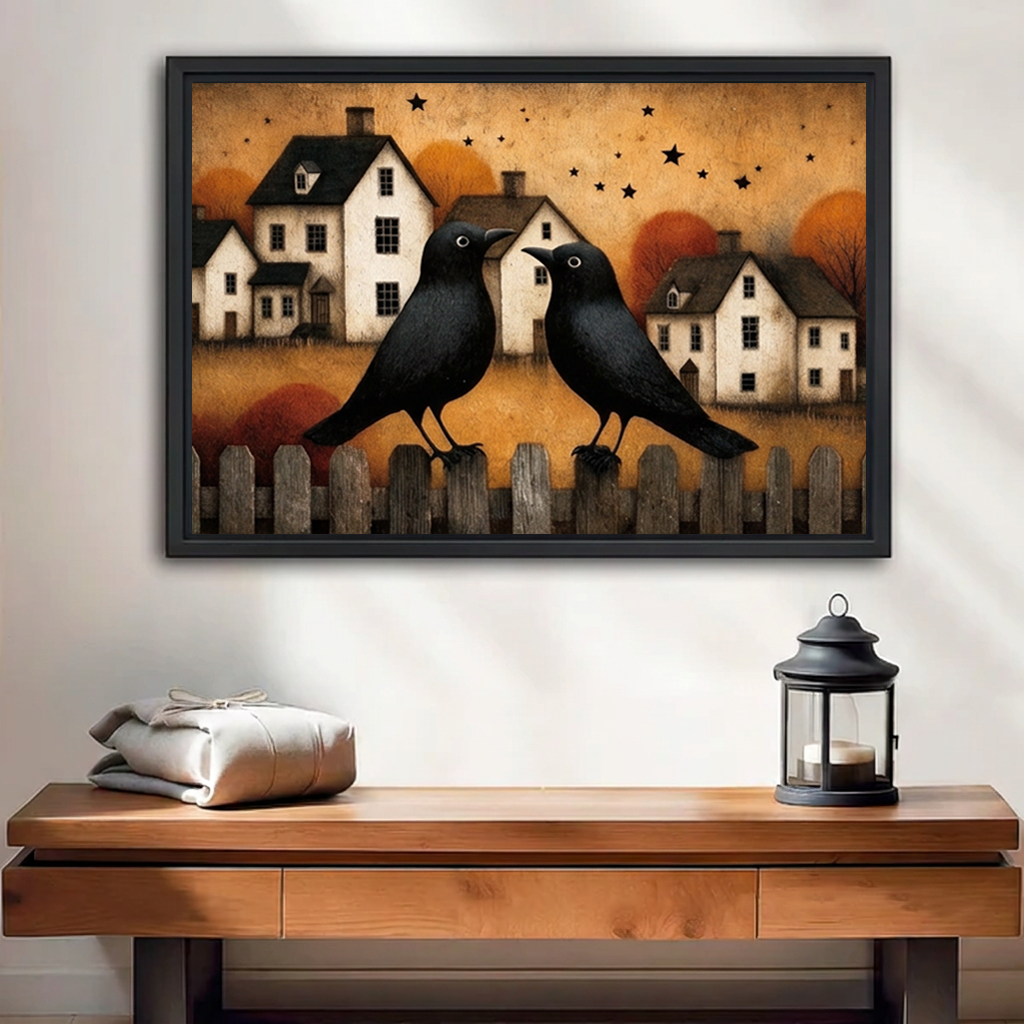 Black-framed folk art autumn crows canvas wall art above a wooden console with folded blankets and a lantern.