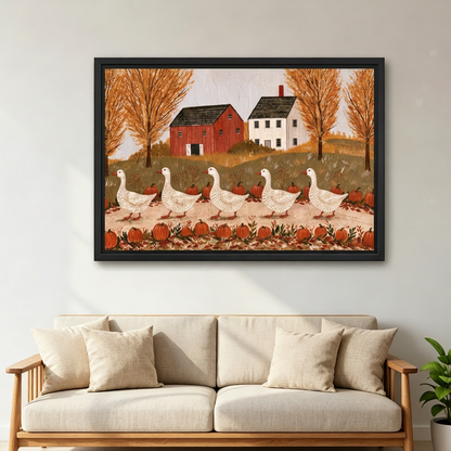 Black-framed folk art autumn geese wall art above a cream sofa, featuring pumpkins, golden trees, and farm buildings.