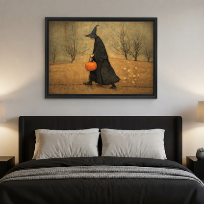Black-framed folk art autumn witch canvas wall art hanging above a dark headboard with white pillows.