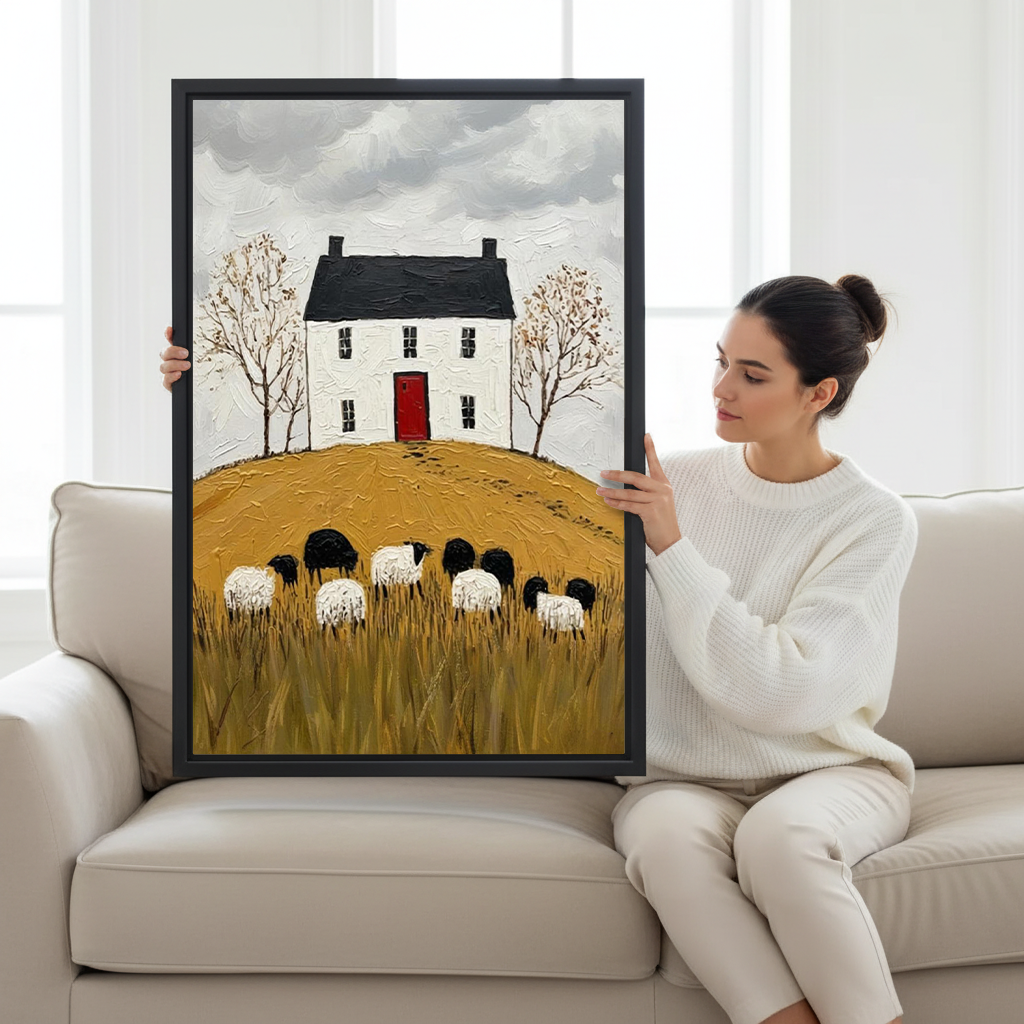 Gallery-wrap cottage and sheep canvas wall art with a golden meadow displayed beside a bed and leafy plant.