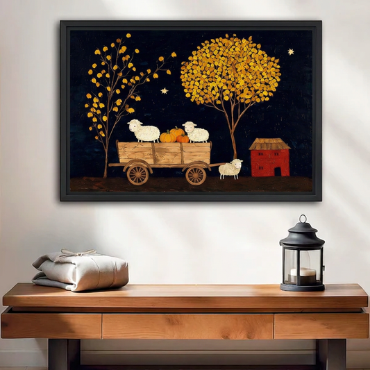  Black-framed folk art harvest sheep canvas wall art displayed above a wooden bench beside a black lantern