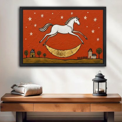 Framed folk art horse moon canvas wall art hanging above a console table with a black lantern.