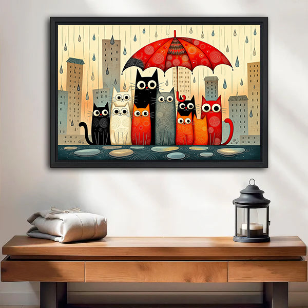 Framed rainy day cats canvas wall art over an entryway bench with a black candle lantern