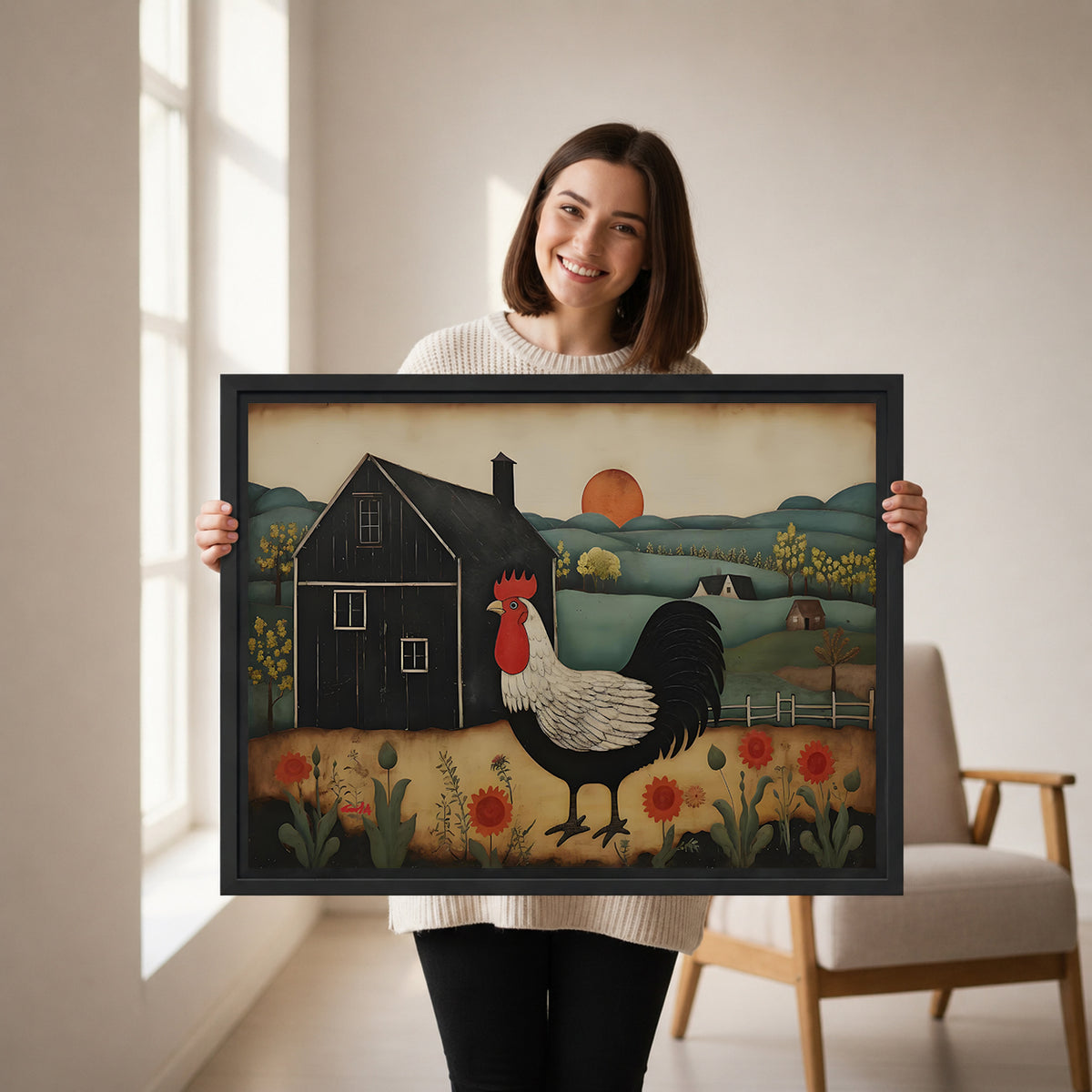 Woman holding framed folk art rooster canvas wall art featuring a black barn, orange sun, and flowers