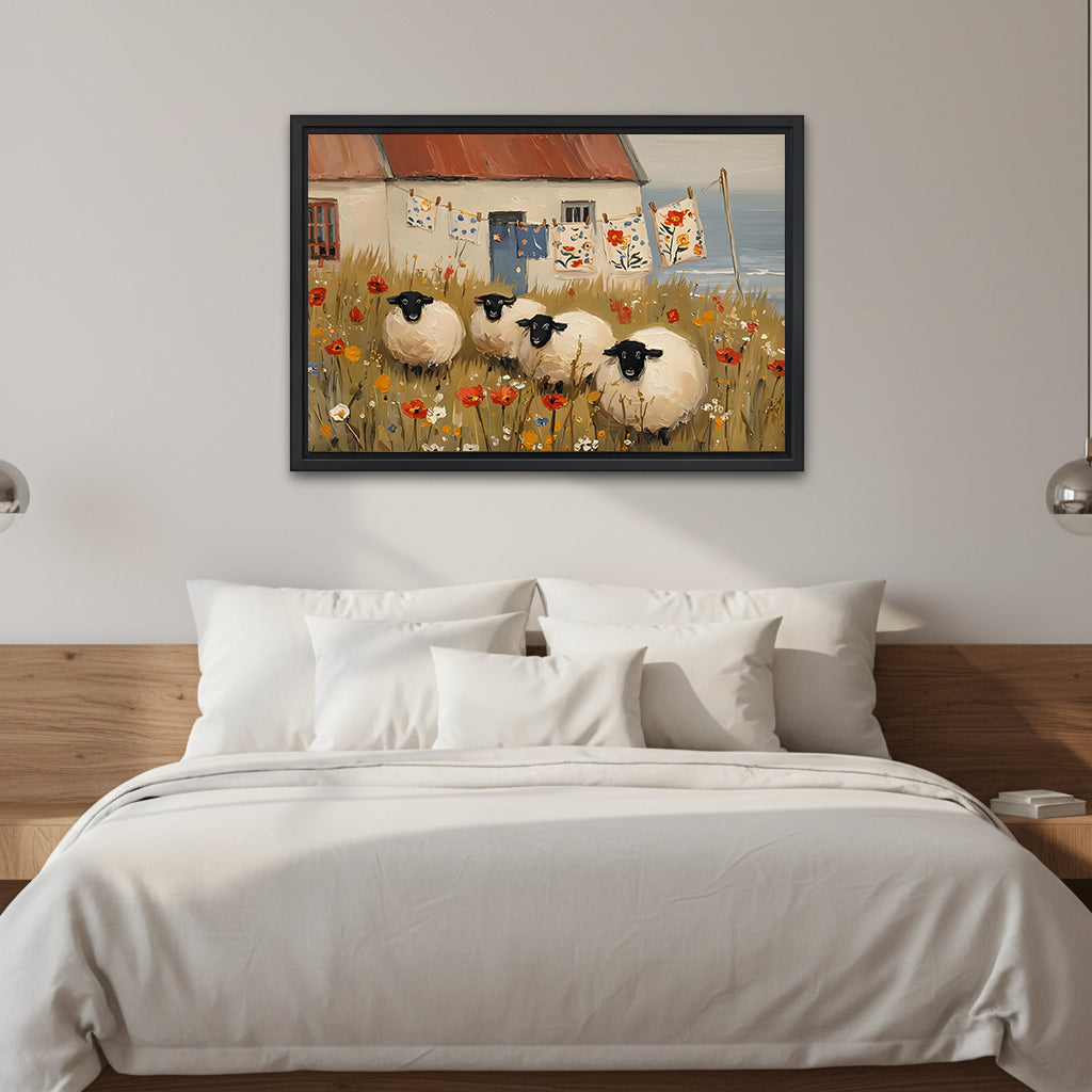 Folk art four black-faced sheep red poppy wildflower meadow coastal cottage black framed canvas wall art on white wall above wood platform bed with crisp white linen and silver globe sconce