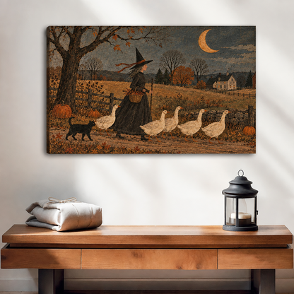 Unframed folk art witch and geese canvas wall art above a wooden console with folded linens and a lantern.