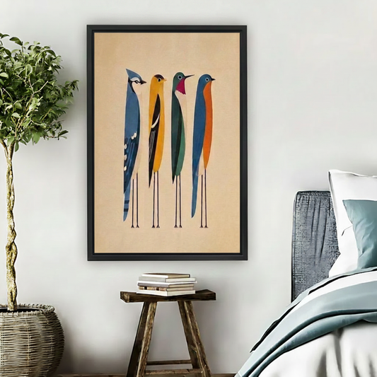 Four colorful North American birds blue jay oriole hummingbird bluebird midcentury modern framed wall art beside rattan bed, bold geometric bird canvas for bedroom