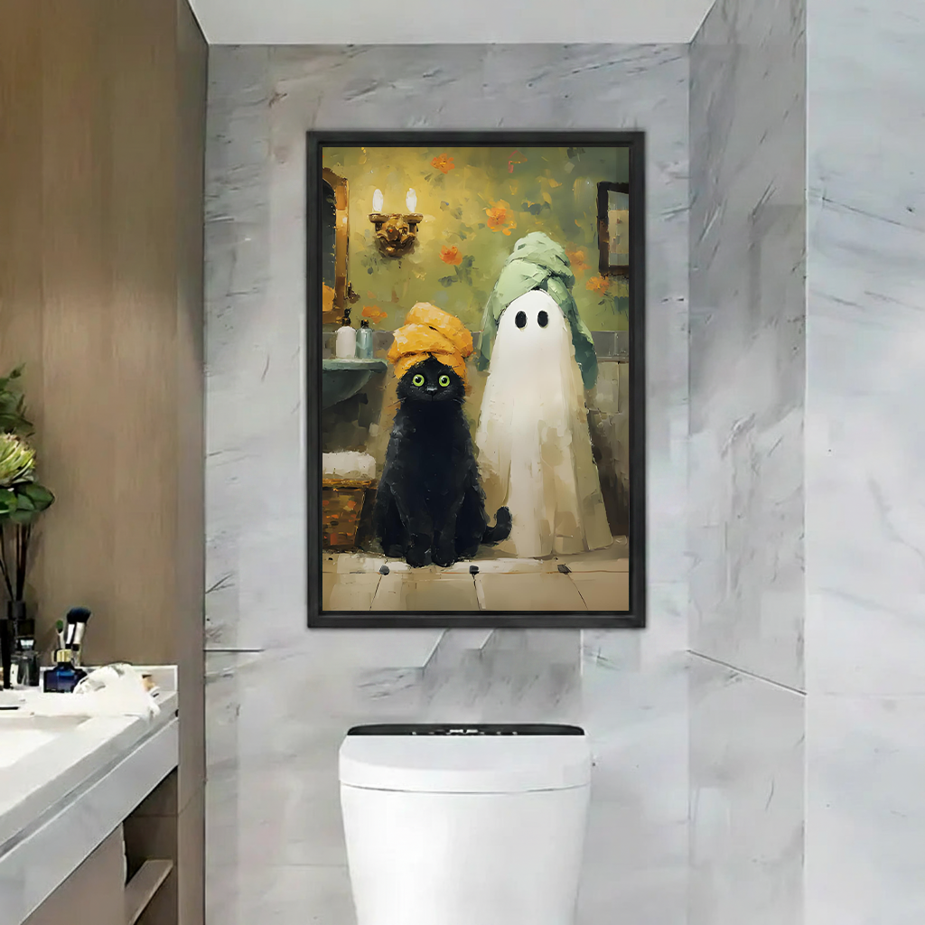 Framed black cat ghost Halloween canvas wall art displayed above a bathroom console with plants and a round mirror