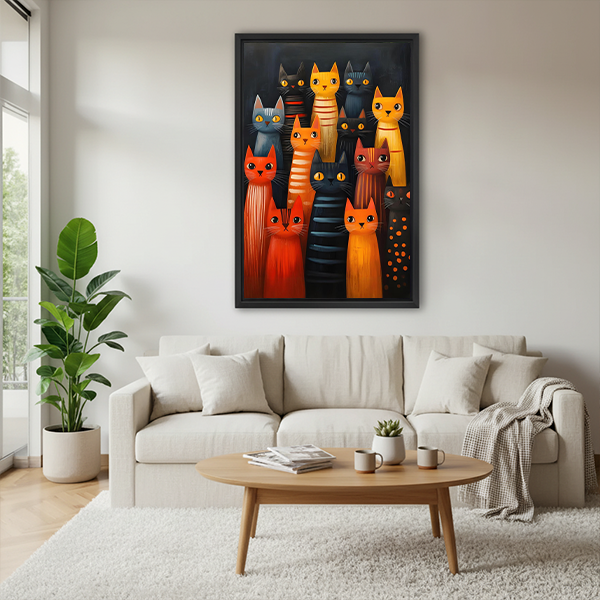 Framed colorful cat canvas wall art with a lively feline group displayed between indoor plants