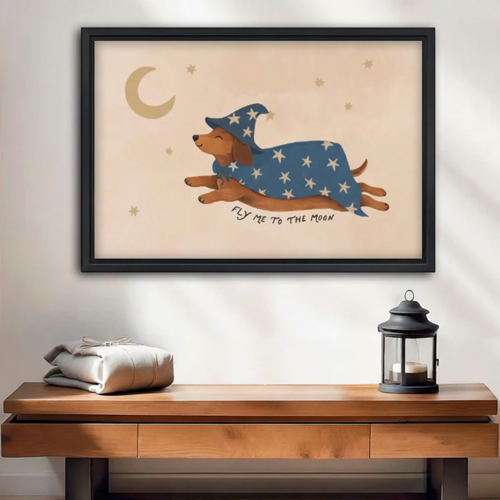 Framed dachshund moon wall art displayed above a wooden entryway table with a black lantern.