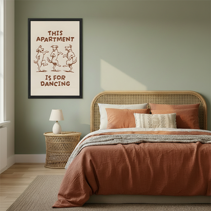 Framed dancing dogs apartment canvas wall art displayed above a cream sofa in a bright living room