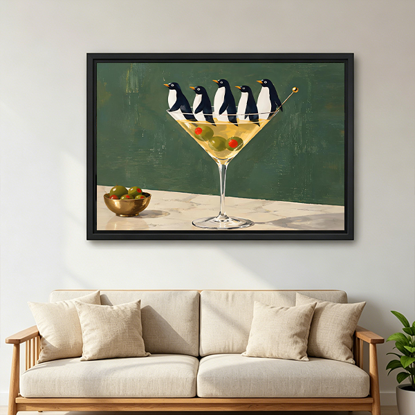 Framed penguin martini canvas wall art hanging above a white bed in a minimalist bedroom.