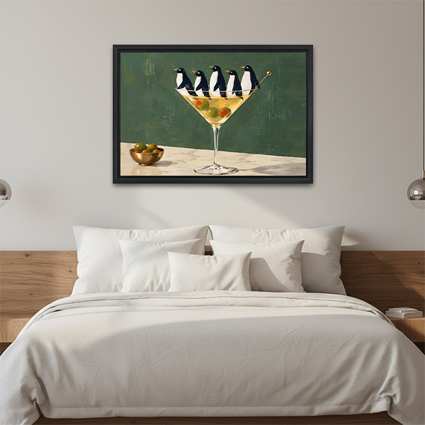 Woman holding framed penguin martini canvas wall art featuring five penguins and green olives.