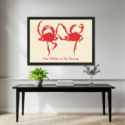 Framed playful red crab kitchen canvas wall art displayed above a black console with green plants