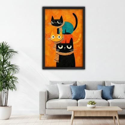 Framed mid-century stacked cats canvas wall art displayed above a white sofa with blue pillows.